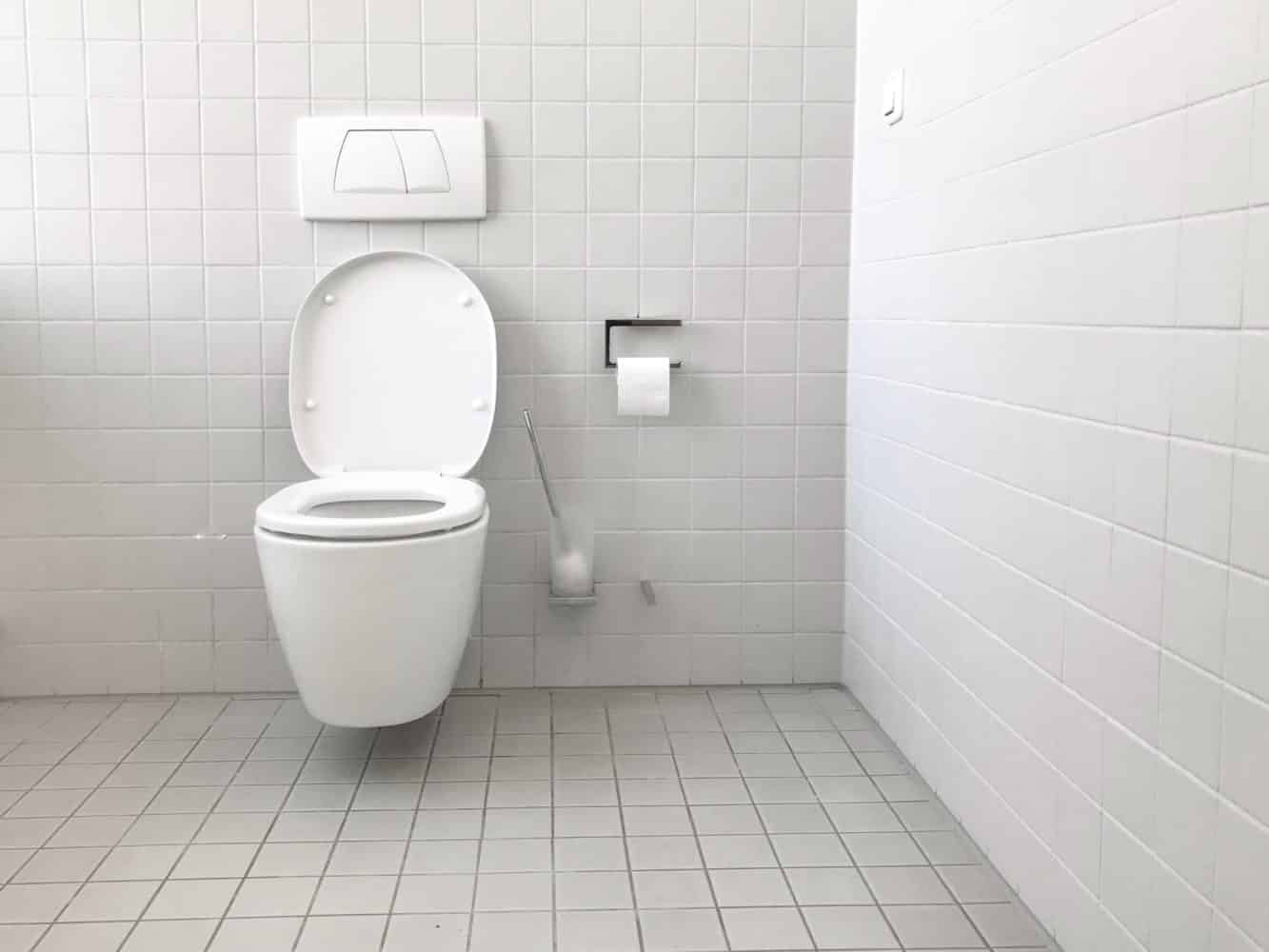 Toilet in Bathroom with White Tile
