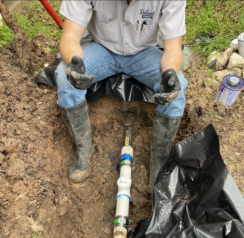 plumber repairing sewer system for residential or commercial property