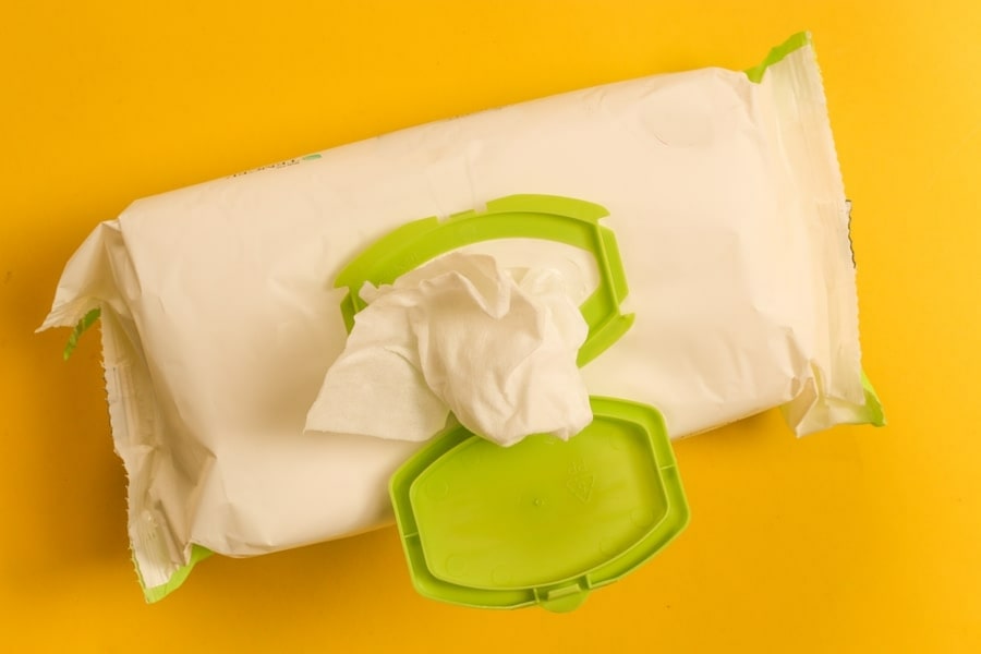 disposable wipes on yellow background