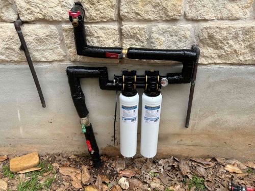 honest water conditioner installation outside of Texas home